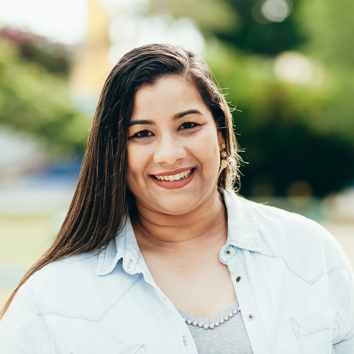 Portrait of beautiful plus size woman in the park