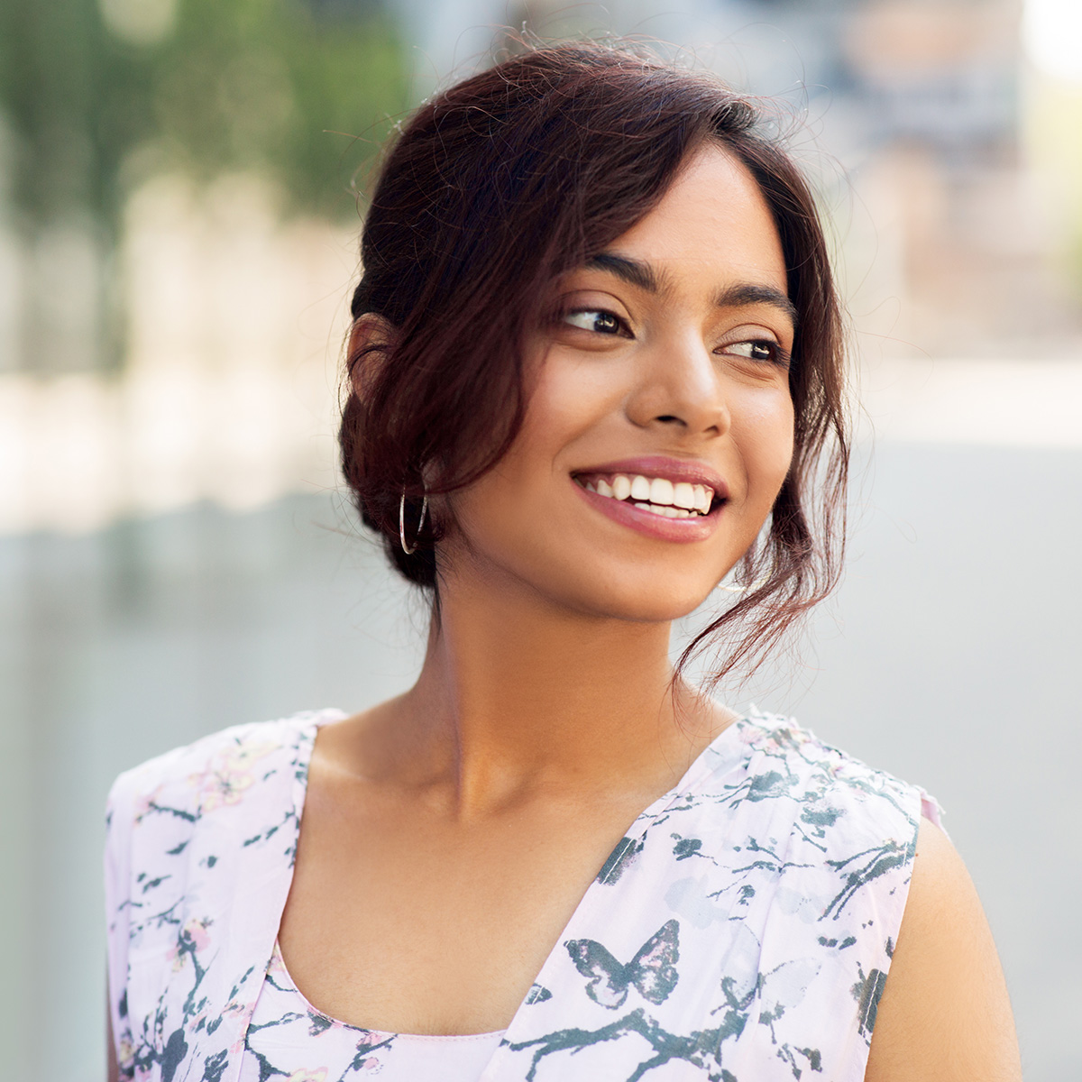 people concept - portrait of happy smiling indian woman outdoors