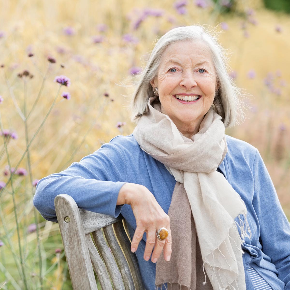 Older woman sitting on park bench